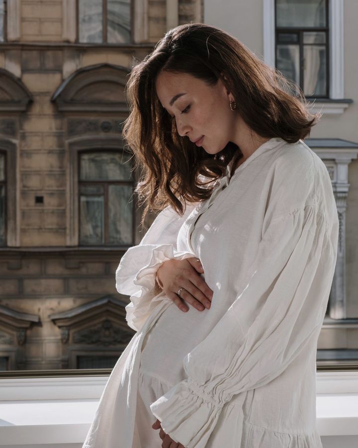 A pregnant woman by the window