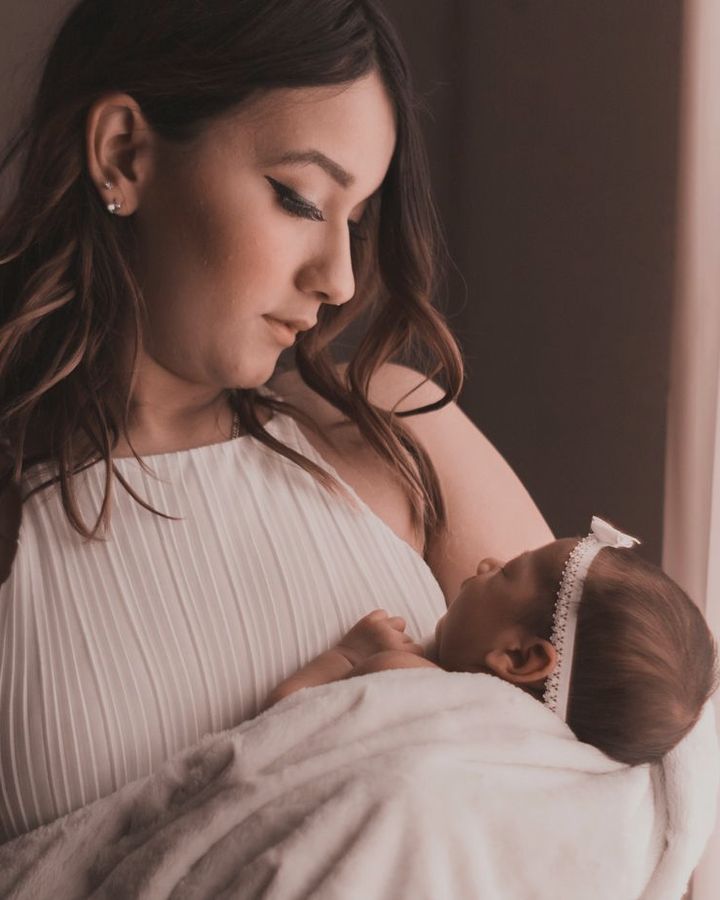 A mother breastfeeding her baby